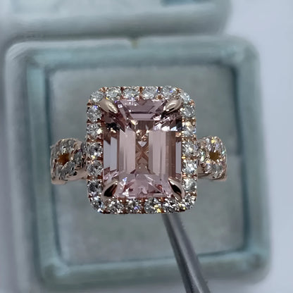 Rose gold electroplated geometric alloy ring on a white background.