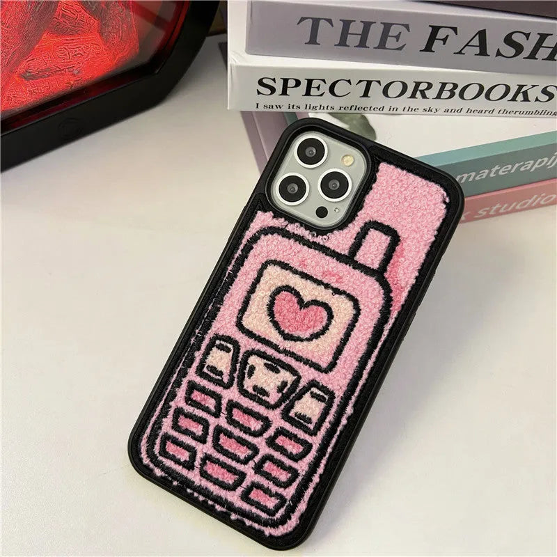 Pink soft TPU iPhone case with a towel-embroidered textured back for models iPhone X to 15.
