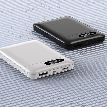 White or black large capacity portable power bank showing dimensions and USB output port.