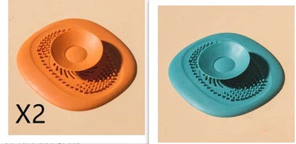 TPR vortex design sink drain cover in twilight orange, quiet blue, mango yellow, and gentian green