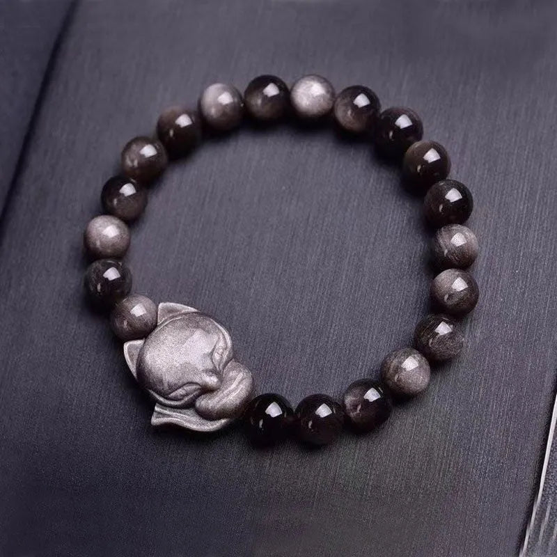Obsidian fox bracelet with 8mm polished black stone bead and sterling silver fox charm on a bracelet chain.
