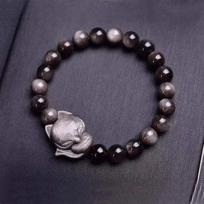 Obsidian fox bracelet with 8mm polished black stone bead and sterling silver fox charm on a bracelet chain.