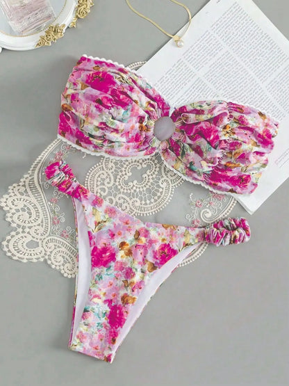 Colourful floral print tube top bikini set with lace trim on a mannequin