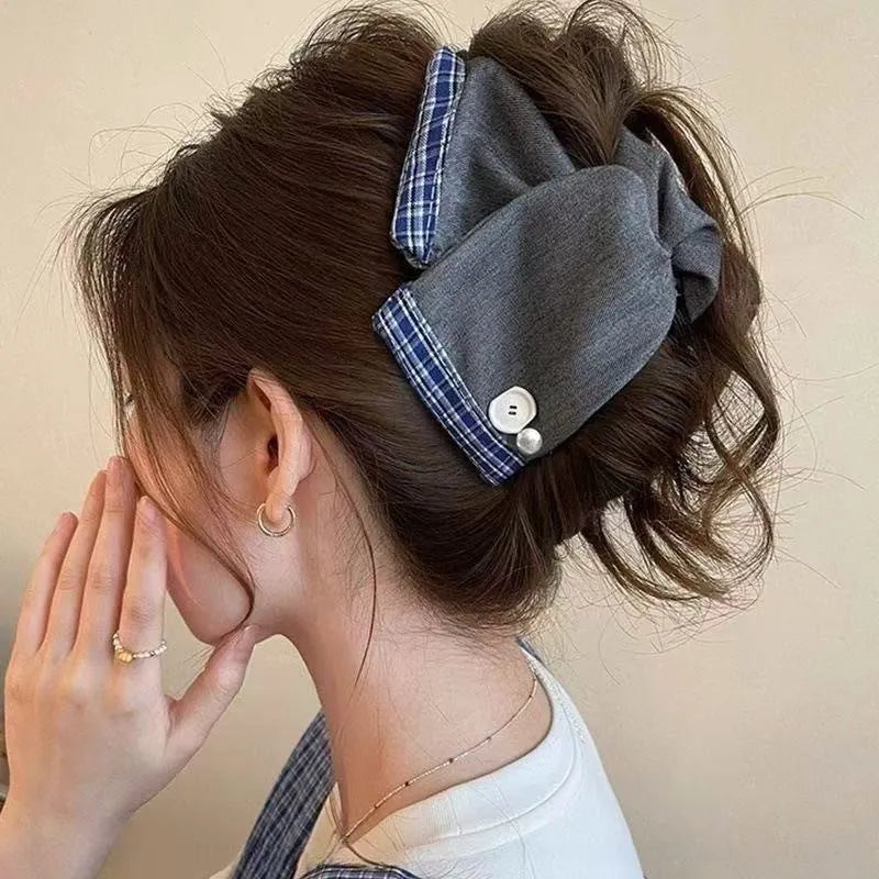 Handmade fabric bow hair grip with triangle grip design and plastic hairpin