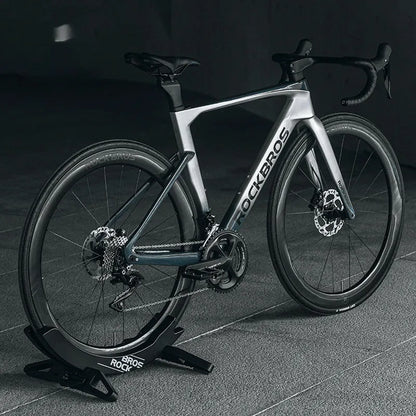 Black ABS plastic wall-mounted bicycle parking rack holder for road and mountain bikes.