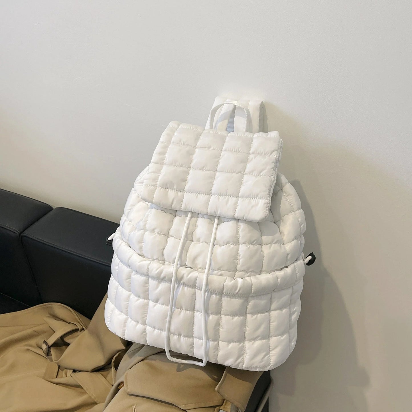 Soft, quilted puffer backpack in a variety of colors, perfect for autumn and winter wear