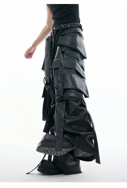 Black loose-fit trousers with quilted texture, multiple pockets, and stitching ribbon leather accents on model