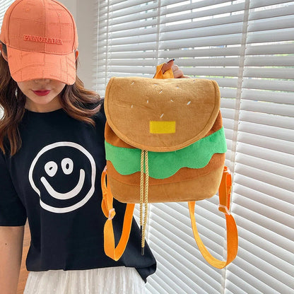 Hamburger-shaped plush backpack with adjustable drawstring and fastening buckle