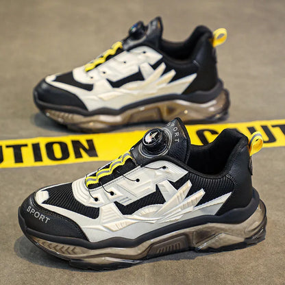 Men's black mesh dad shoes with rotating button detail and a low platform sole