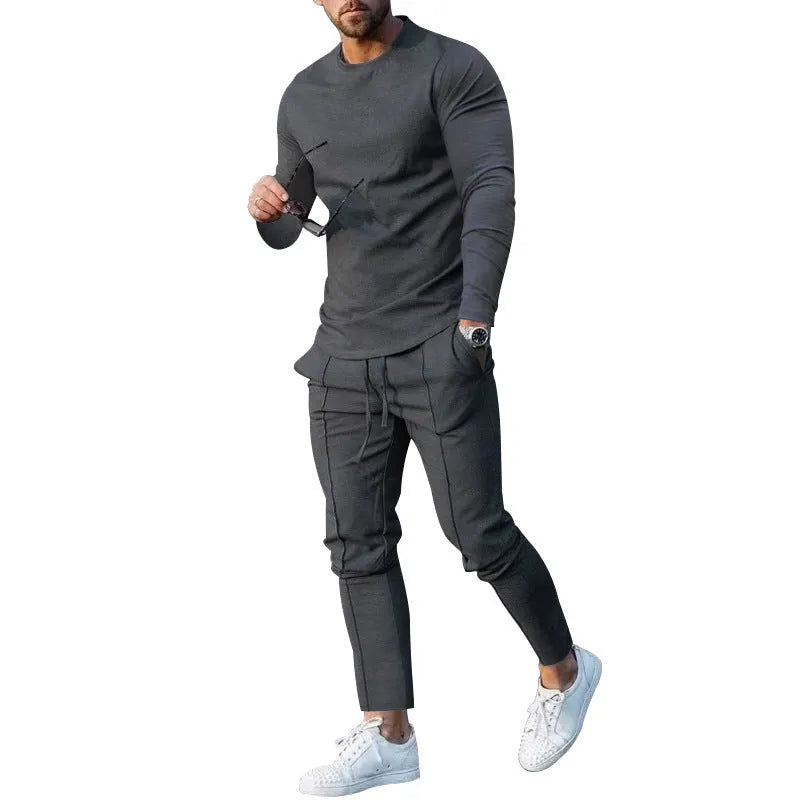 Men's light grey polyester two-piece suit set with long sleeve round neck T-shirt and matching trousers.