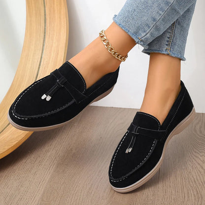Solid colour canvas platform loafers with a rubber sole and round toe in apricot, shown from a side angle.