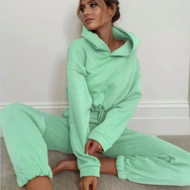 Stylish and comfortable 2-piece tracksuit set for women featuring a hoodie and relaxed-fit pants in a variety of vibrant colors