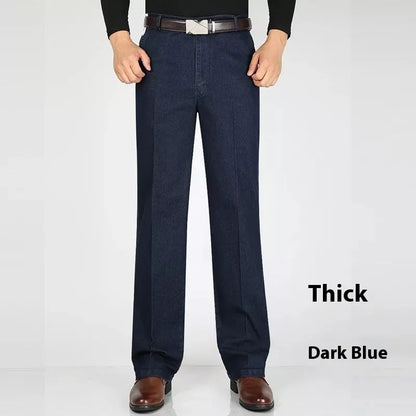 Men's high waist loose fit blue jeans on a hanger showing zip fly and casual style.