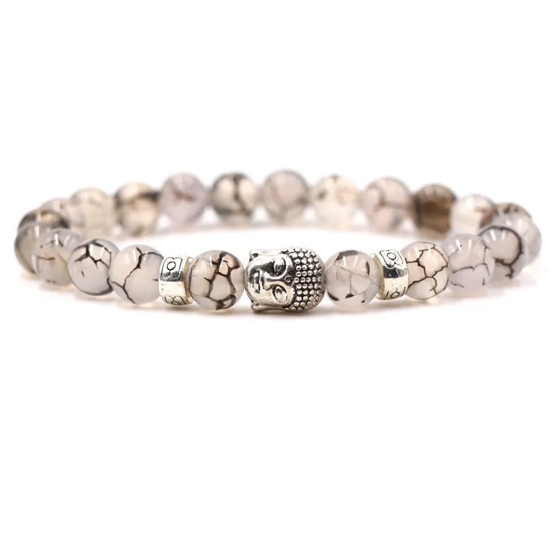 Natural stone stretch bracelet with round beads in various colours including Tigereye and turquoise.