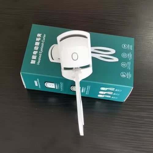 Electric Heating Eyelash Curler in white, pink, and green colors for safe, effective lash curling