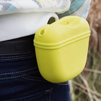 Black silicone dog training treat pouch with clip and magnetic closure shown attached to a belt.