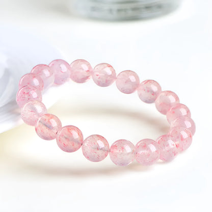 Stretch bracelet with round faceted strawberry quartz crystal beads in a white water colour.