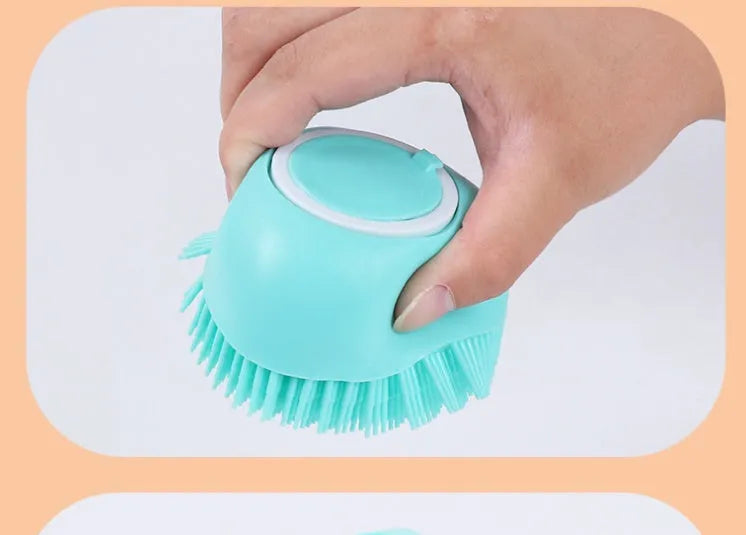 Blue silicone dog bath and massage brush held in a hand.