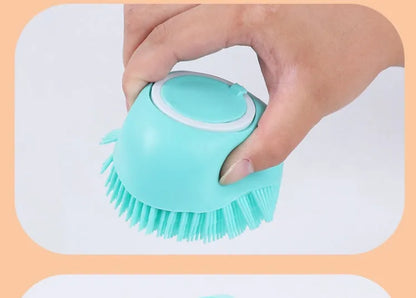 Blue silicone dog bath and massage brush held in a hand.
