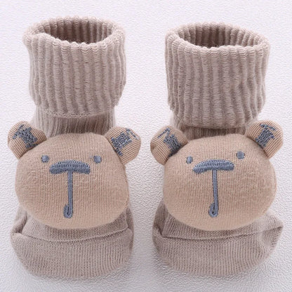 Cotton baby floor socks in assorted colours and patterns including bows, stars, and animal designs.