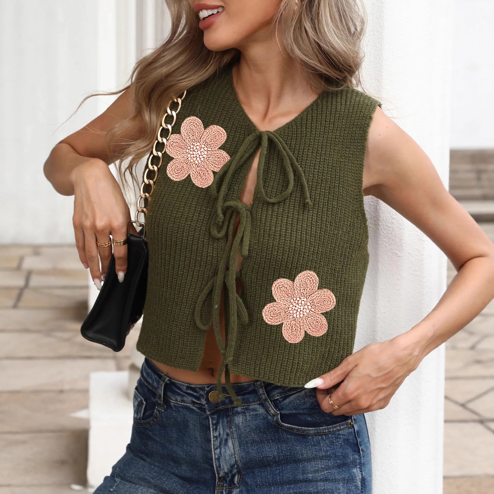 White deer plush polyester vest cardigan with lace-up front, bow, and apricot flower embroidery on chest.