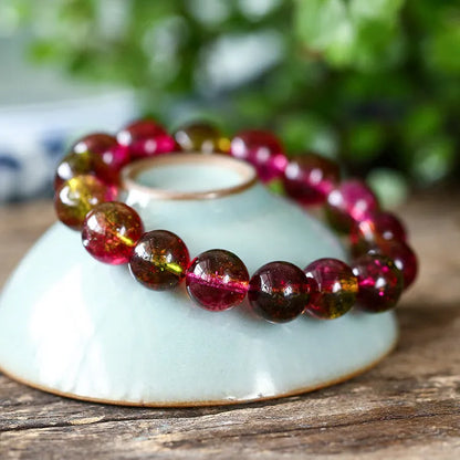 Women's personalised bracelet with hand-threaded watermelon crystal beads.