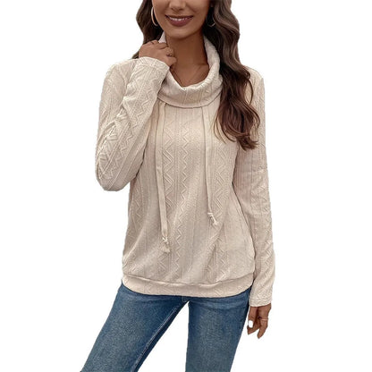 Apricot coloured long sleeve hooded pullover sweater with drawstring on a hanger