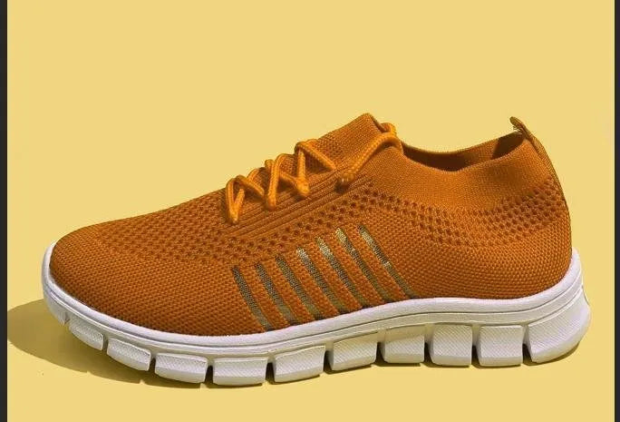 Women's lace-up platform sneaker in multiple colours with a low-top profile and rubber sole.