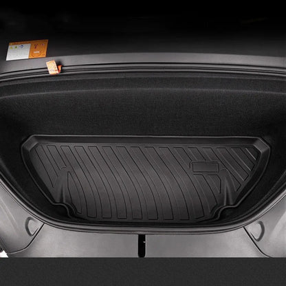 Black TPE rubber floor mats for Tesla Model 3, showing deep grooves and raised edges on driver's side.