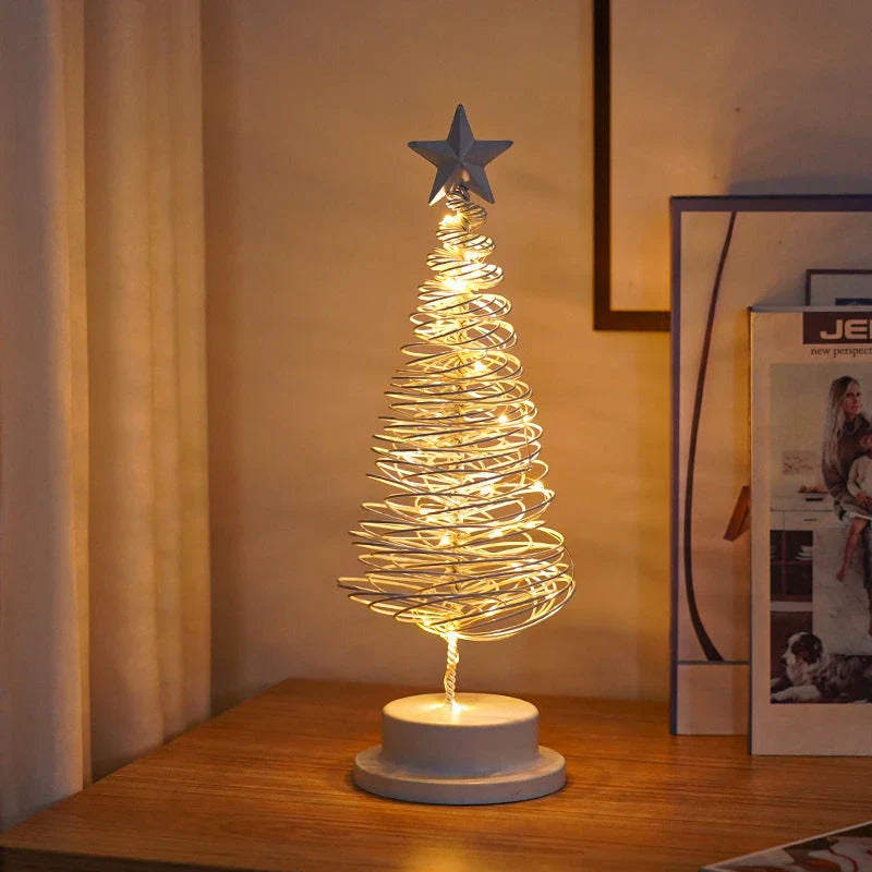 Lighted metal Christmas tree with warm white LED lights, creating a cozy holiday decor for homes and offices.