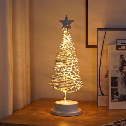 Lighted metal Christmas tree with warm white LED lights, creating a cozy holiday decor for homes and offices.