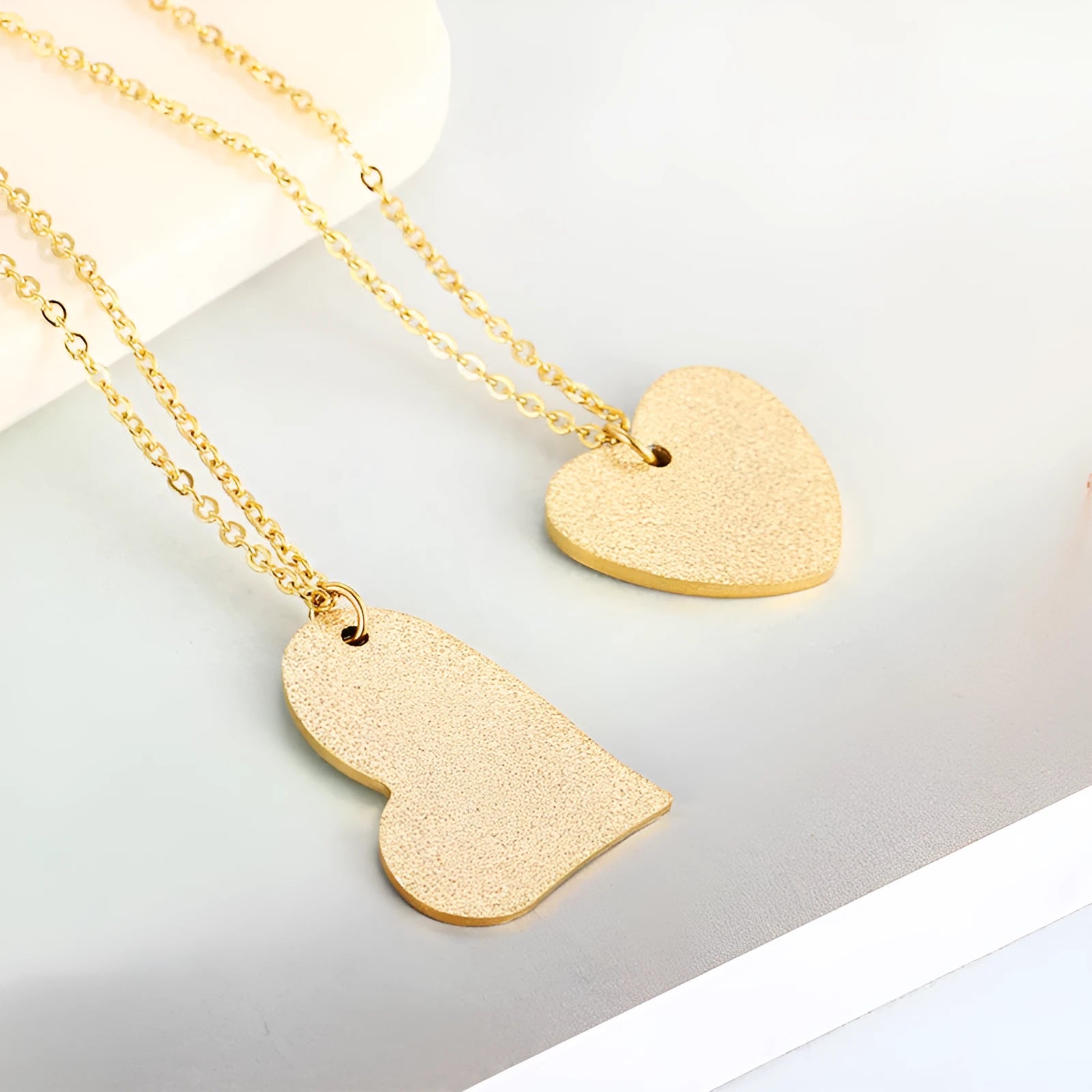 Women's titanium steel necklace with a simple geometric heart-shaped pendant.