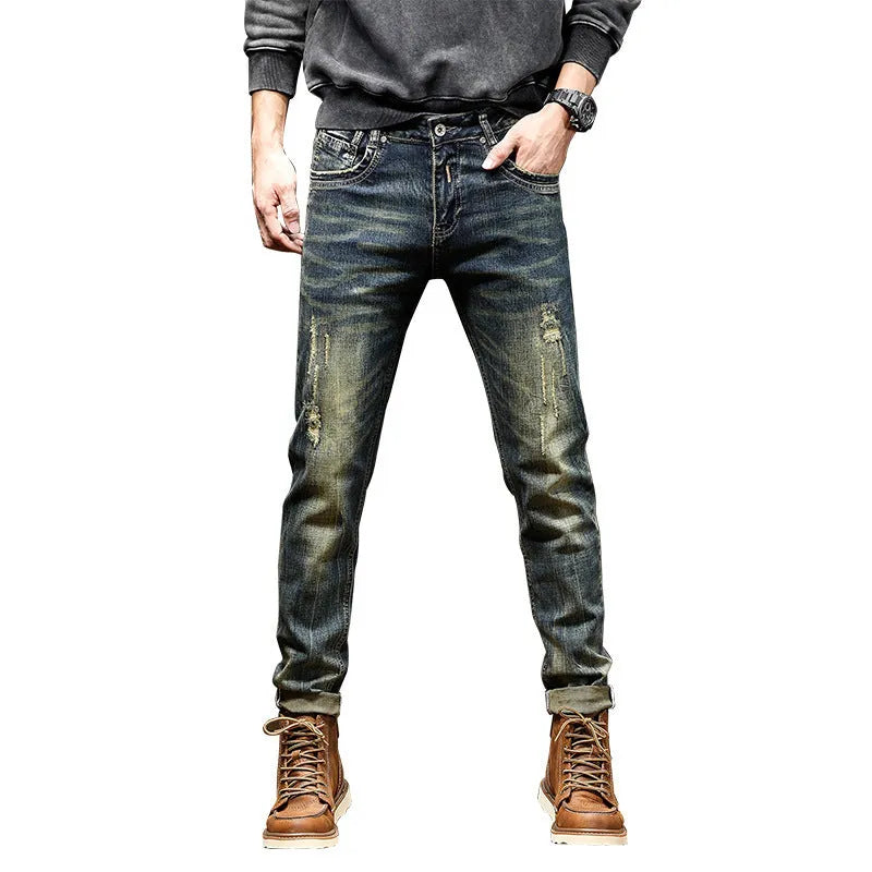 Men's skinny fit stretch denim jeans in retro colour with zip fly, shown in leisure setting.