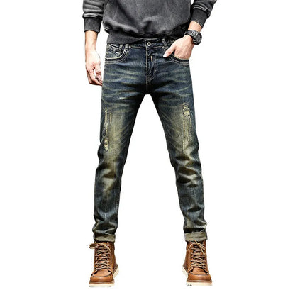 Men's skinny fit stretch denim jeans in retro colour with zip fly, shown in leisure setting.
