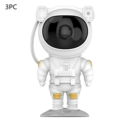 Astronaut-themed galaxy projector with adjustable nebula effects on table showing starry sky projection