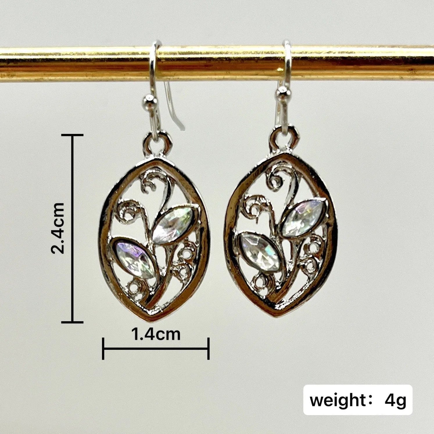 Silver-coloured leaf-shaped earrings for women with a central colourful moonstone on a post back.