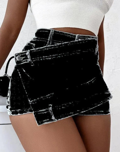 Stylish Y2K-inspired denim shorts with an asymmetrical hemline, high-waist design, and stretch fabric for a flattering fit