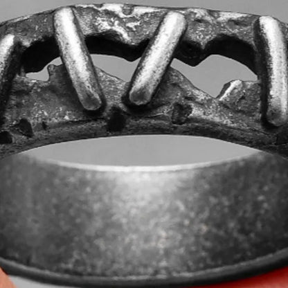 Stainless steel double ring with dark punk stitching pattern showing layered band design