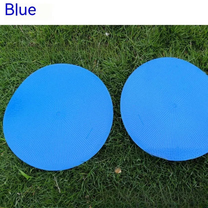 Soft yellow TPE football landmark pad disc on grass, 23 cm diameter.