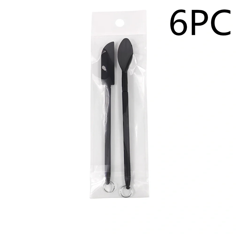 Retractable silicone cosmetic spatula extended to 15cm with scraper tool for product application
