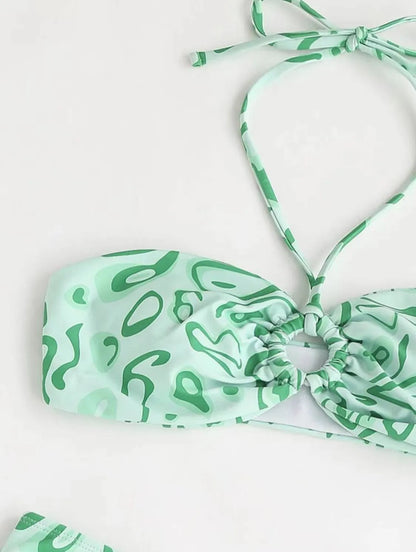Blue floral pattern bandeau bikini swimsuit with backless design on mannequin