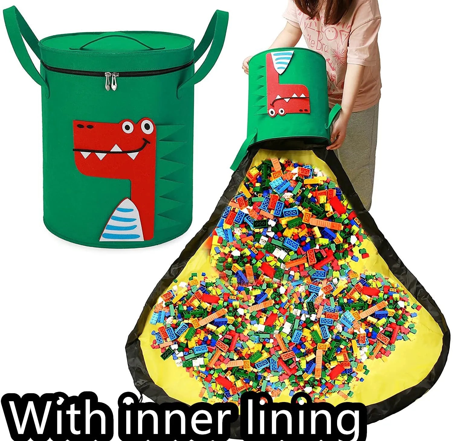 Green felt storage cube with pull rope unfolded into a large square play mat on a wooden floor.