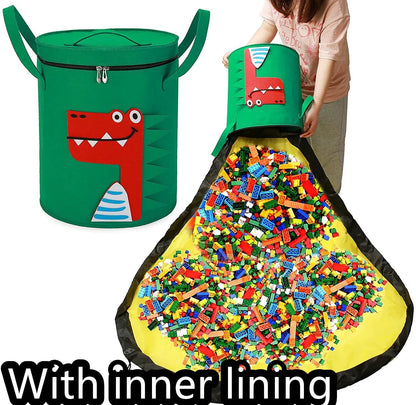 Green felt storage cube with pull rope unfolded into a large square play mat on a wooden floor.