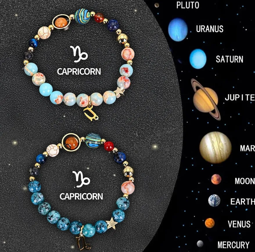Set of two natural stone beaded bracelets showing zodiac sign designs on an elastic cord.
