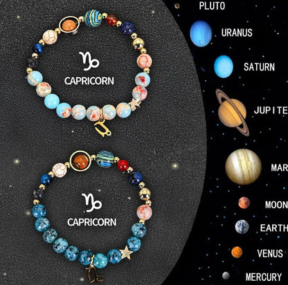 Set of two natural stone beaded bracelets showing zodiac sign designs on an elastic cord.