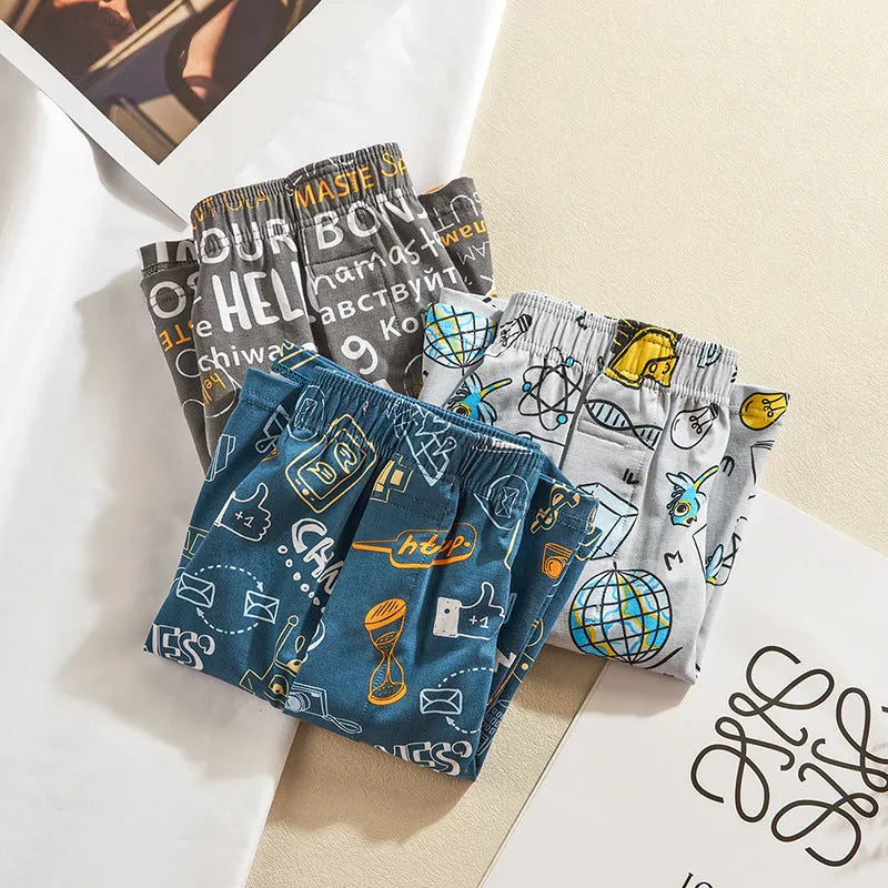Men's cotton boxer shorts with graphic patterns including character designs and floral motifs
