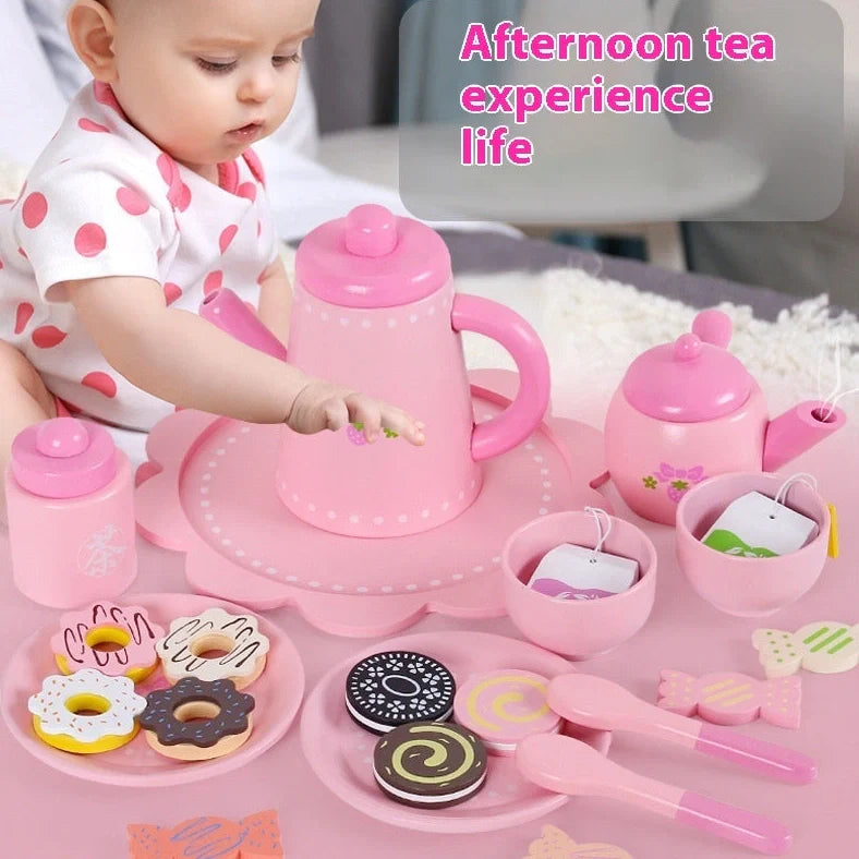 Wooden children's tea set in Barbara pink with cookie pattern, includes teapot and cups for pretend play