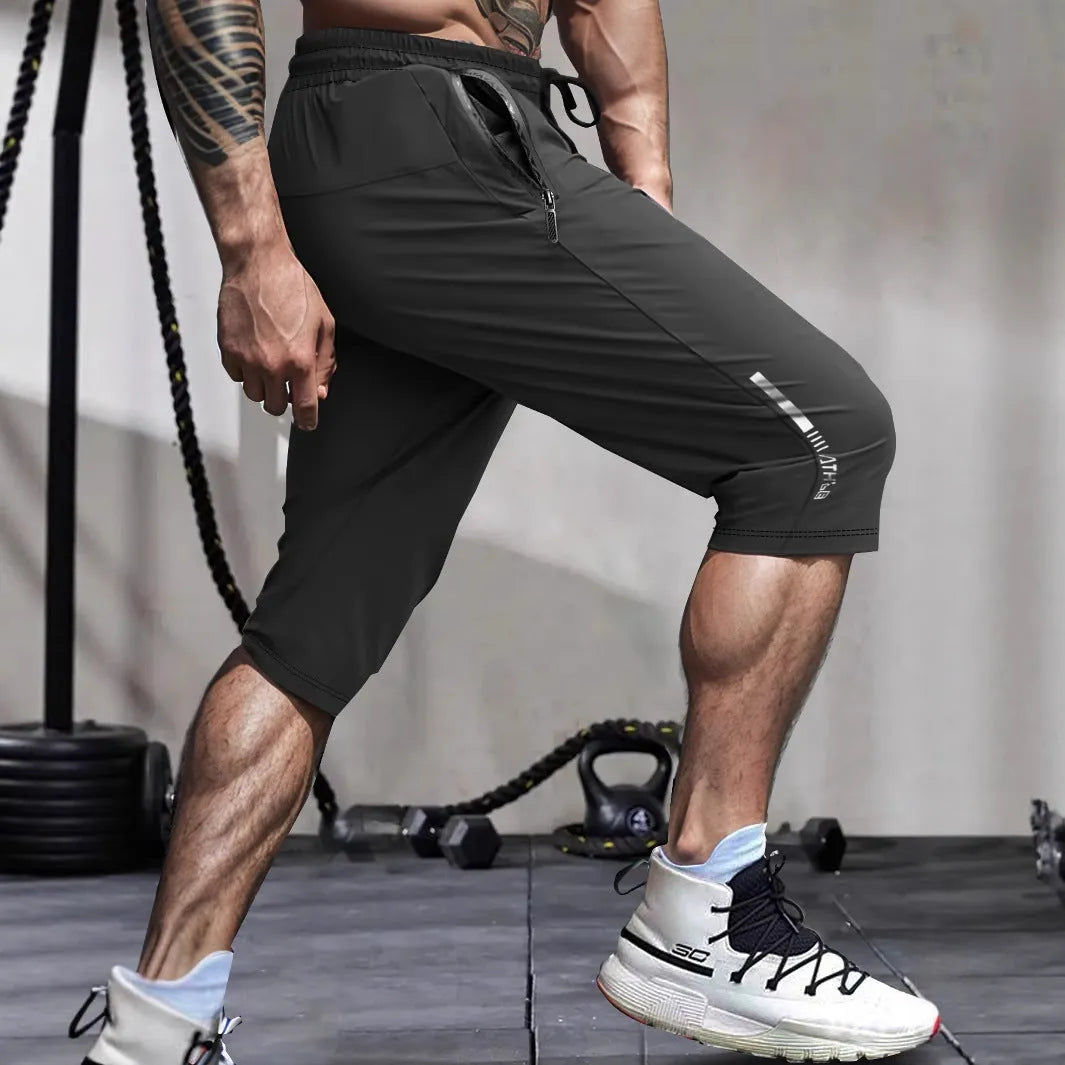 Men's cropped sports pants in quick-drying nylon with straight fit and elastic waistband