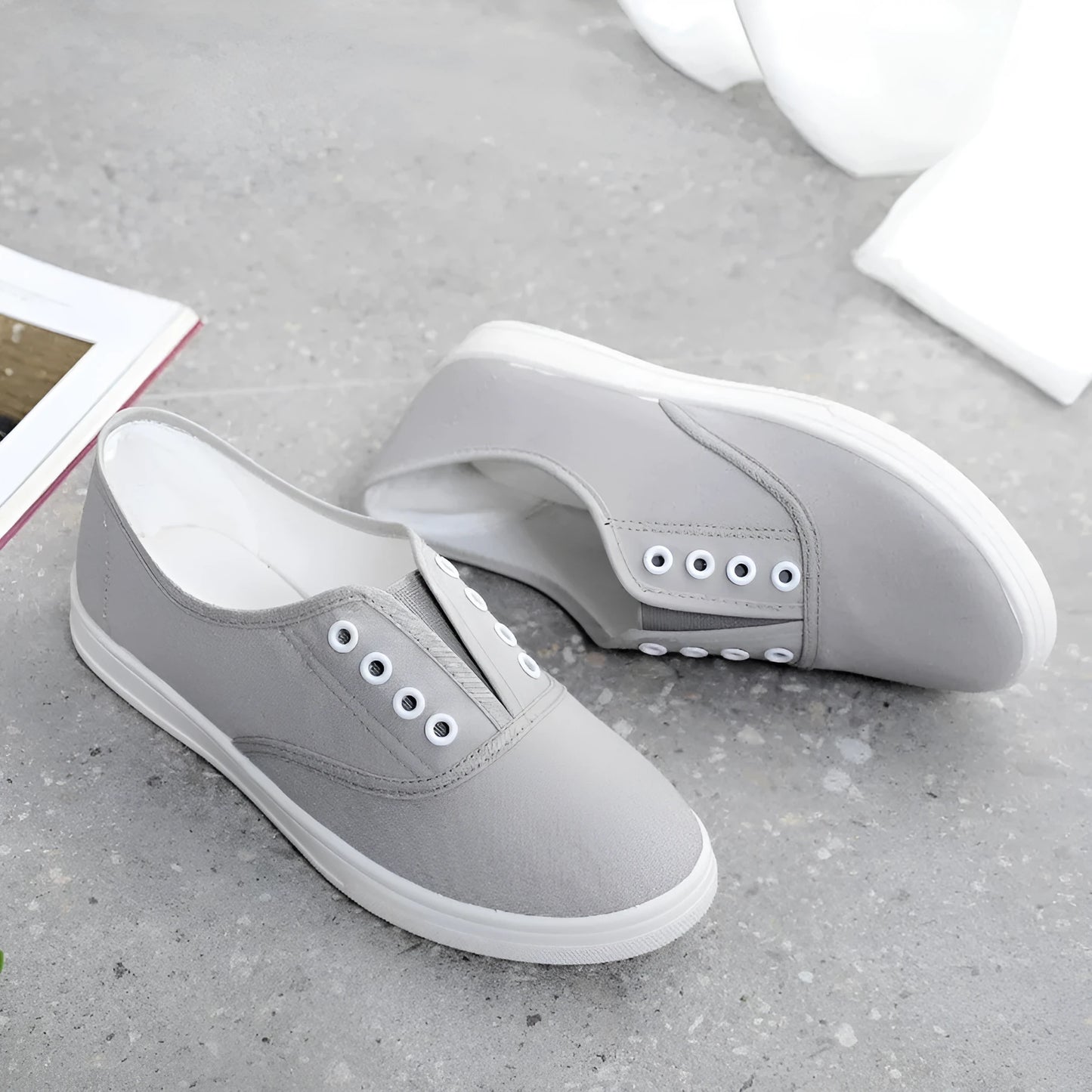 Low-top canvas casual shoes in various colours on a flat sole.