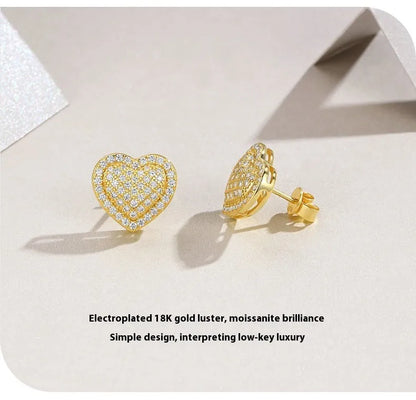 Golden S925 silver stud earrings with a heart-shaped moissanite stone.
